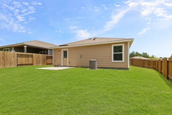 a front view of house with yard and seating area