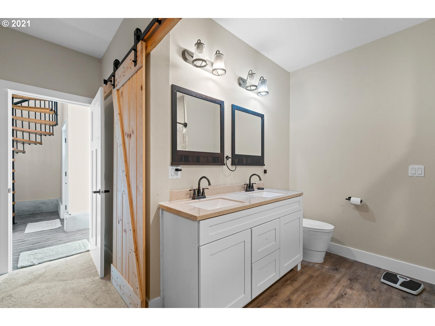 2110 Pioneer Street Ridgefield, WA 98642 - Photo 8 of 32 a bathroom with a toilet sink a mirror and shower