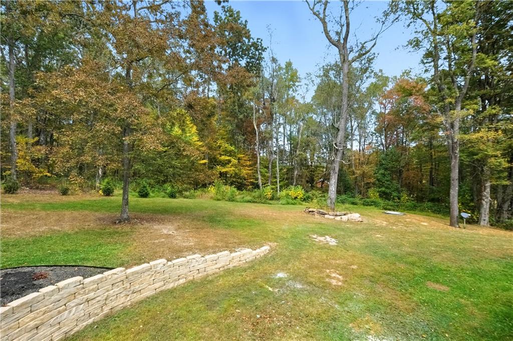 292 Golden Ridge Drive Somerset, PA 15501 - Photo 43 of 49 a backyard of a house with lots of green space and trees