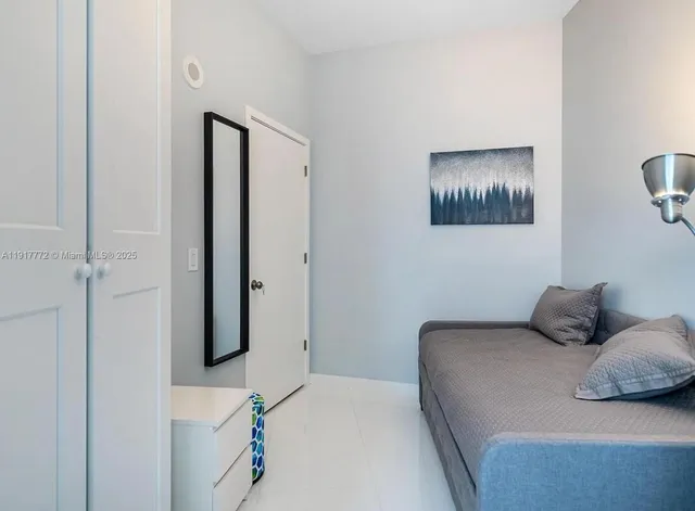 a bedroom with a bed and a table