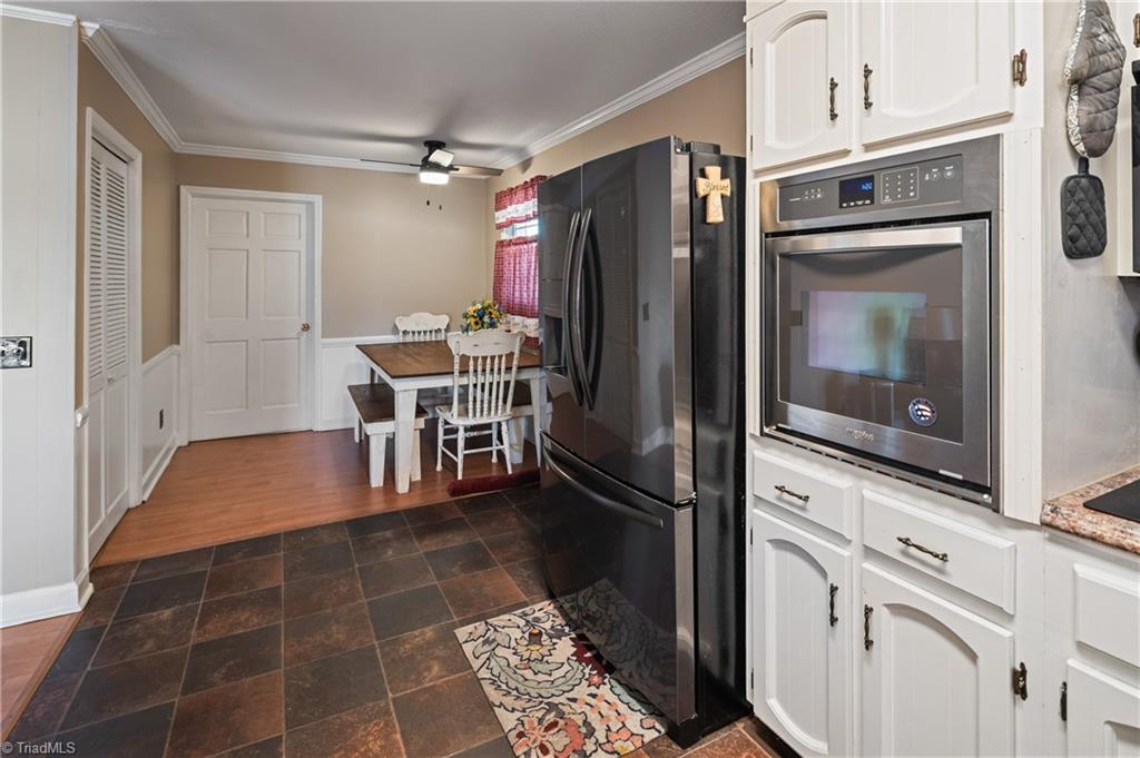 2198 South McKinney Road Mount Airy, NC 27030 - Photo 12 of 50 Dining space with laundry beyond the closed door.