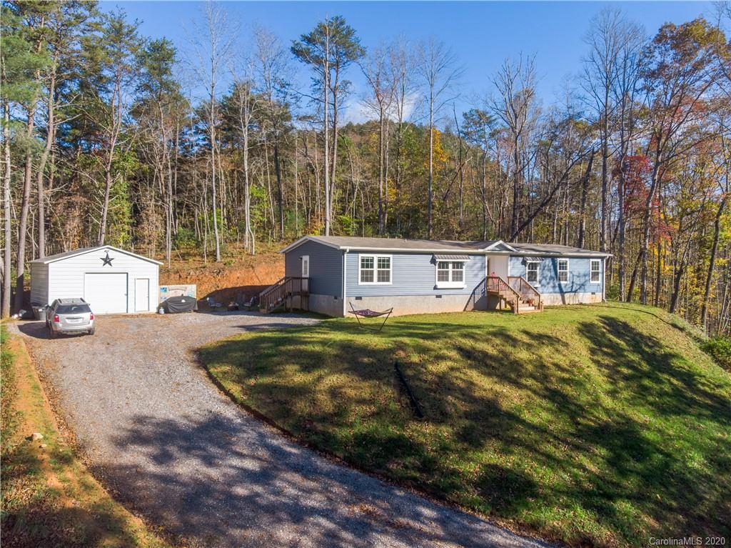 824 Dillsboro Road Sylva, NC 28779 - Photo 2 of 39 a view of a house with a yard