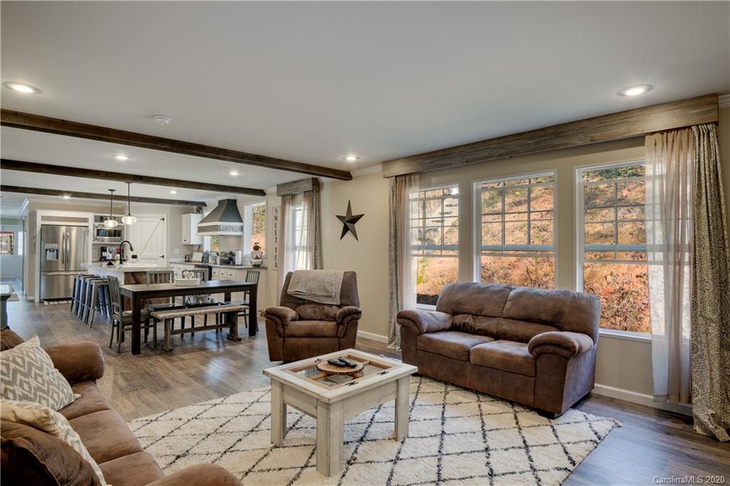 824 Dillsboro Road Sylva, NC 28779 - Photo 13 of 39 a living room with furniture and a large window