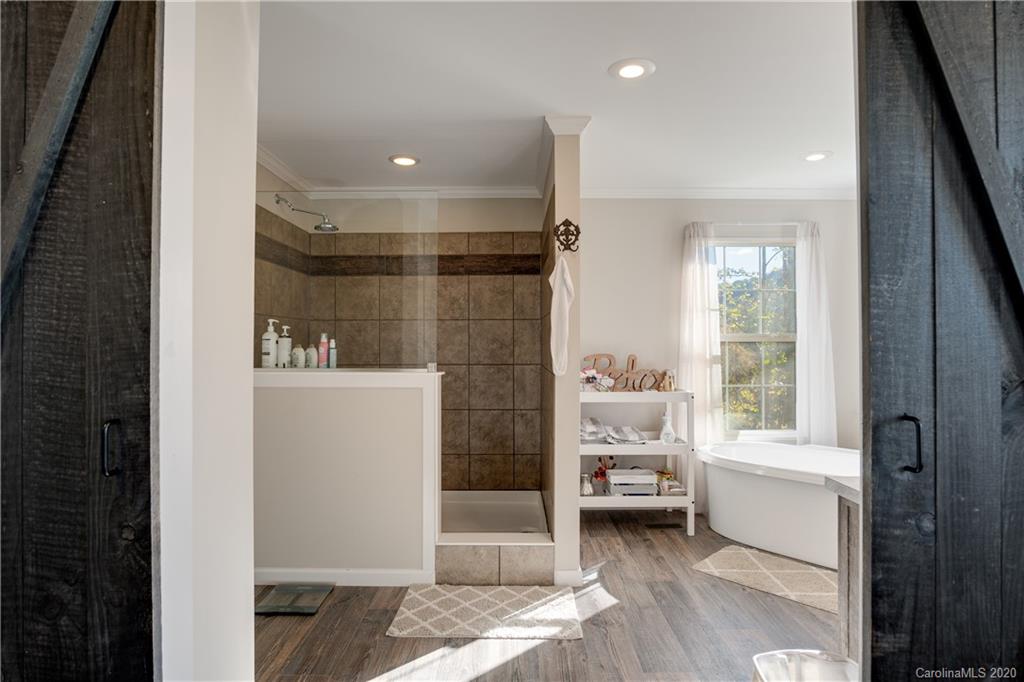 824 Dillsboro Road Sylva, NC 28779 - Photo 16 of 39 a bathroom with a sink and a shower
