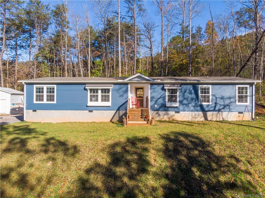 824 Dillsboro Road Sylva, NC 28779 - Photo 3 of 39 a view of a house with swimming pool and porch