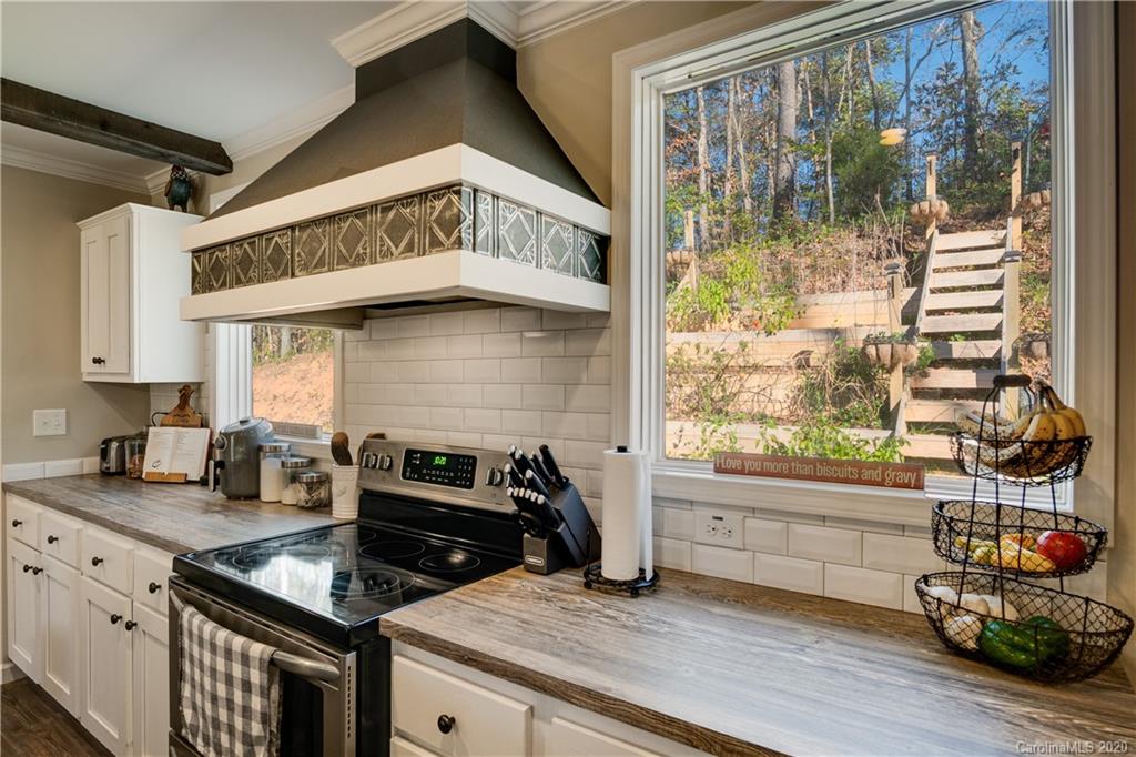 824 Dillsboro Road Sylva, NC 28779 - Photo 8 of 39 a kitchen with a stove and a microwave