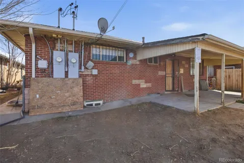 a view of a house with a garage and balcony