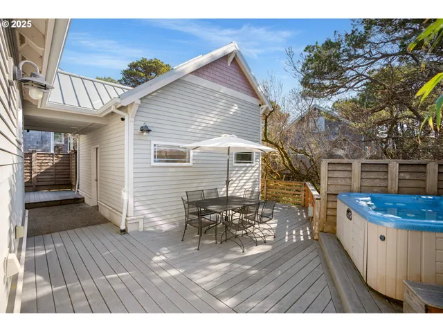a view of a patio with wooden floor