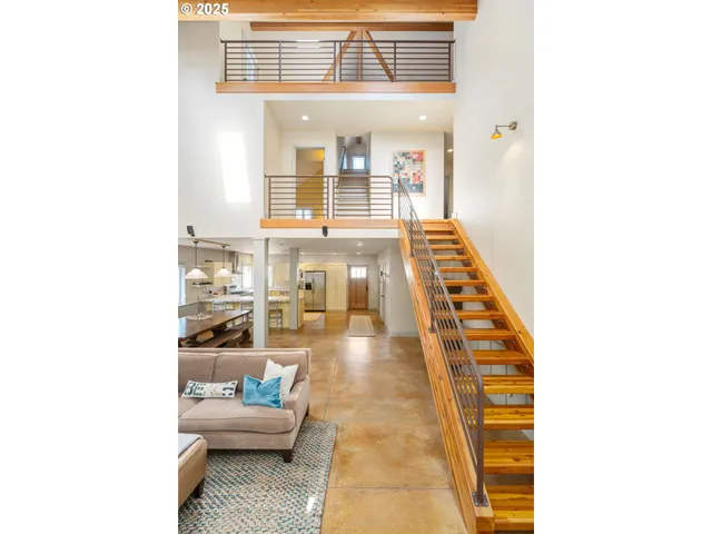 a hallway with a couch and a window