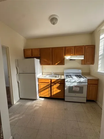 a view of staircase with white walls and a window
