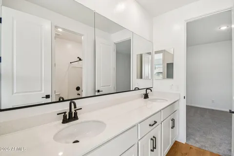 an empty room with closet and bathroom