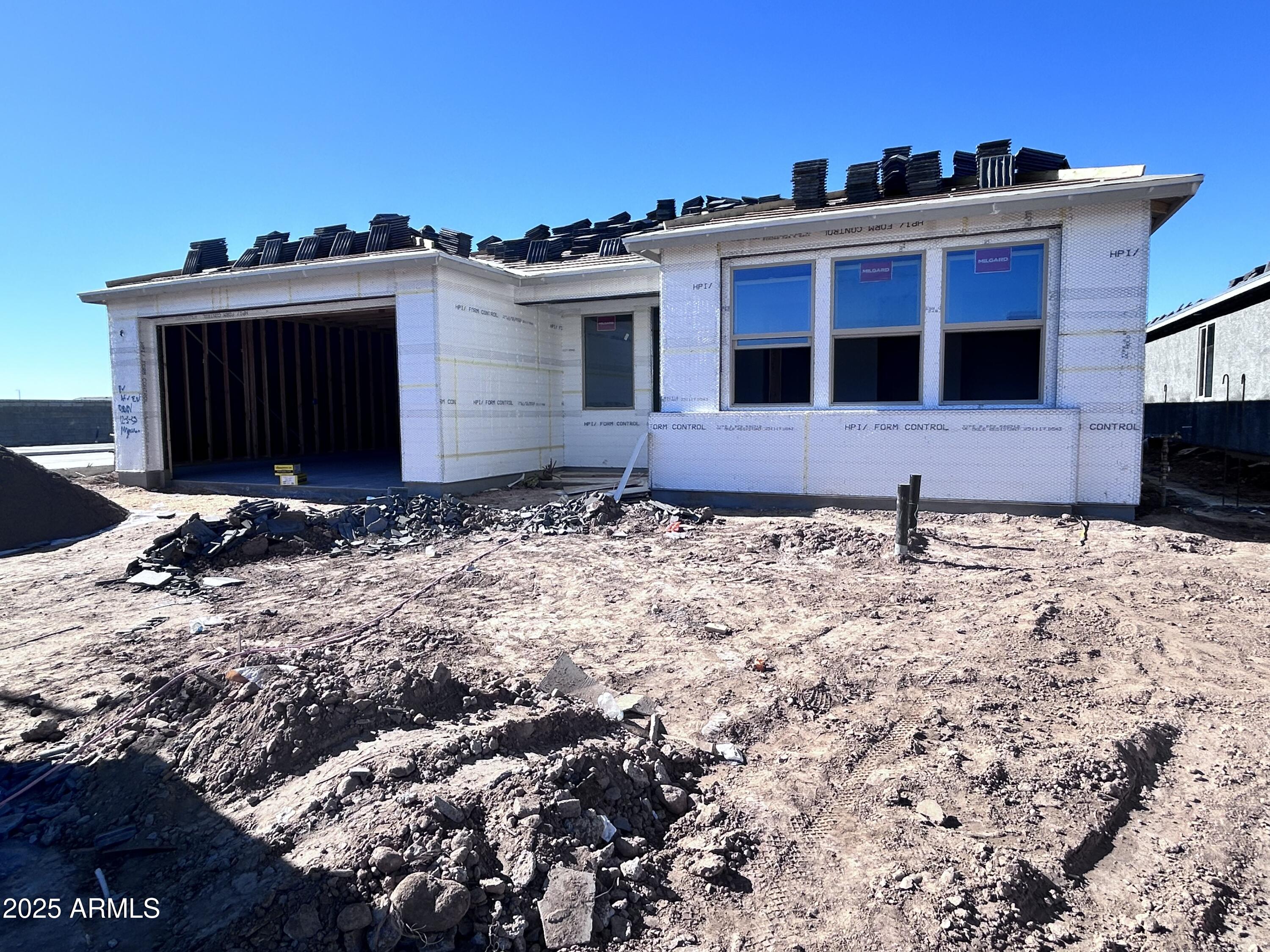 32116 Buckaroo Road San Tan Valley, AZ 85140 - Photo 2 of 15 a front view of a house with a yard