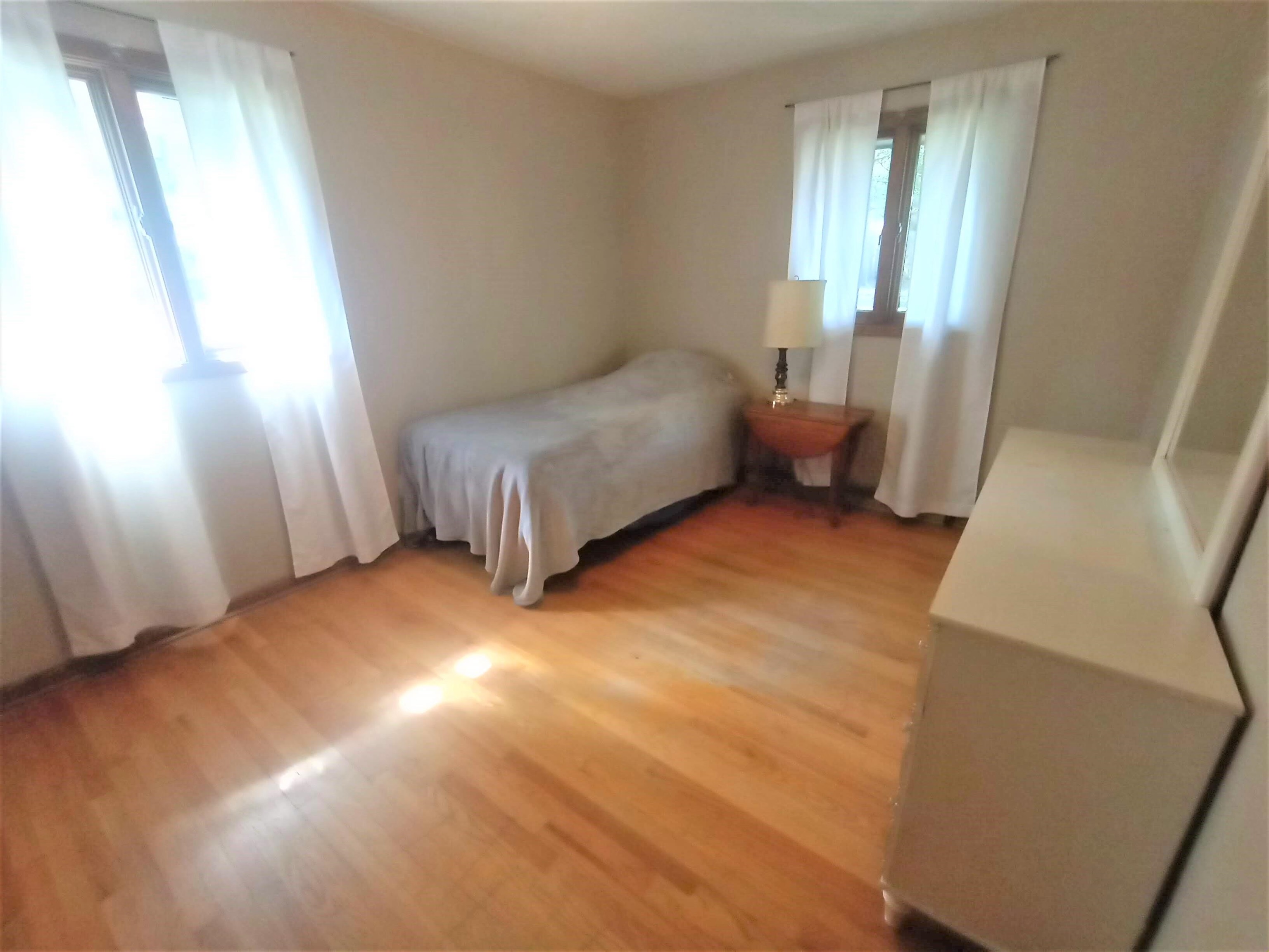 5242 Brookview Road Rockford, IL 61107 - Photo 14 of 44 a bedroom with a bed and a large window