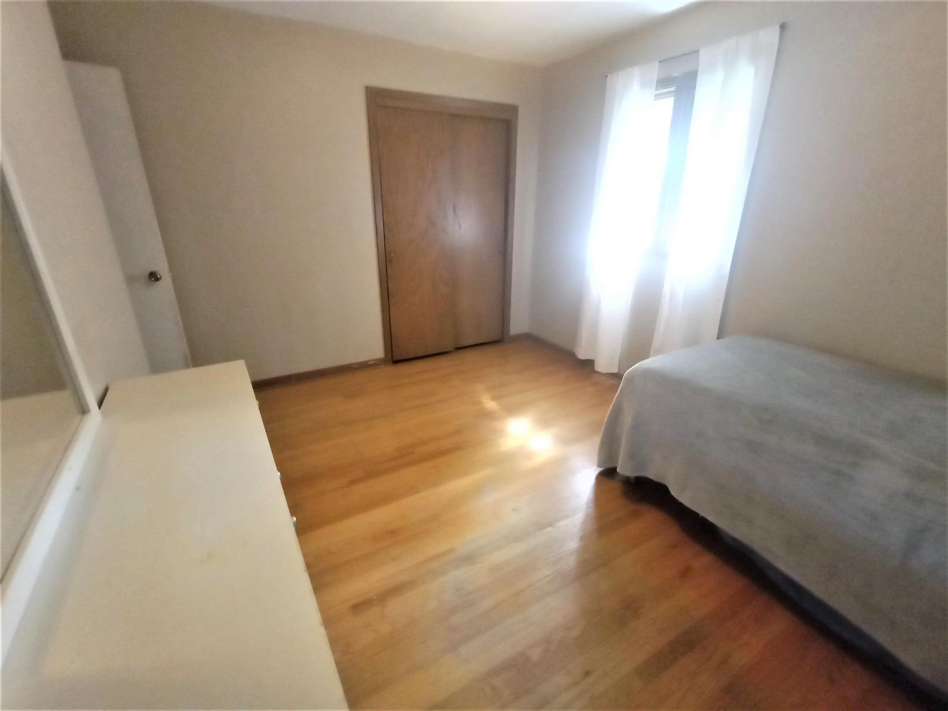 5242 Brookview Road Rockford, IL 61107 - Photo 15 of 44 a bedroom with a bed and a window