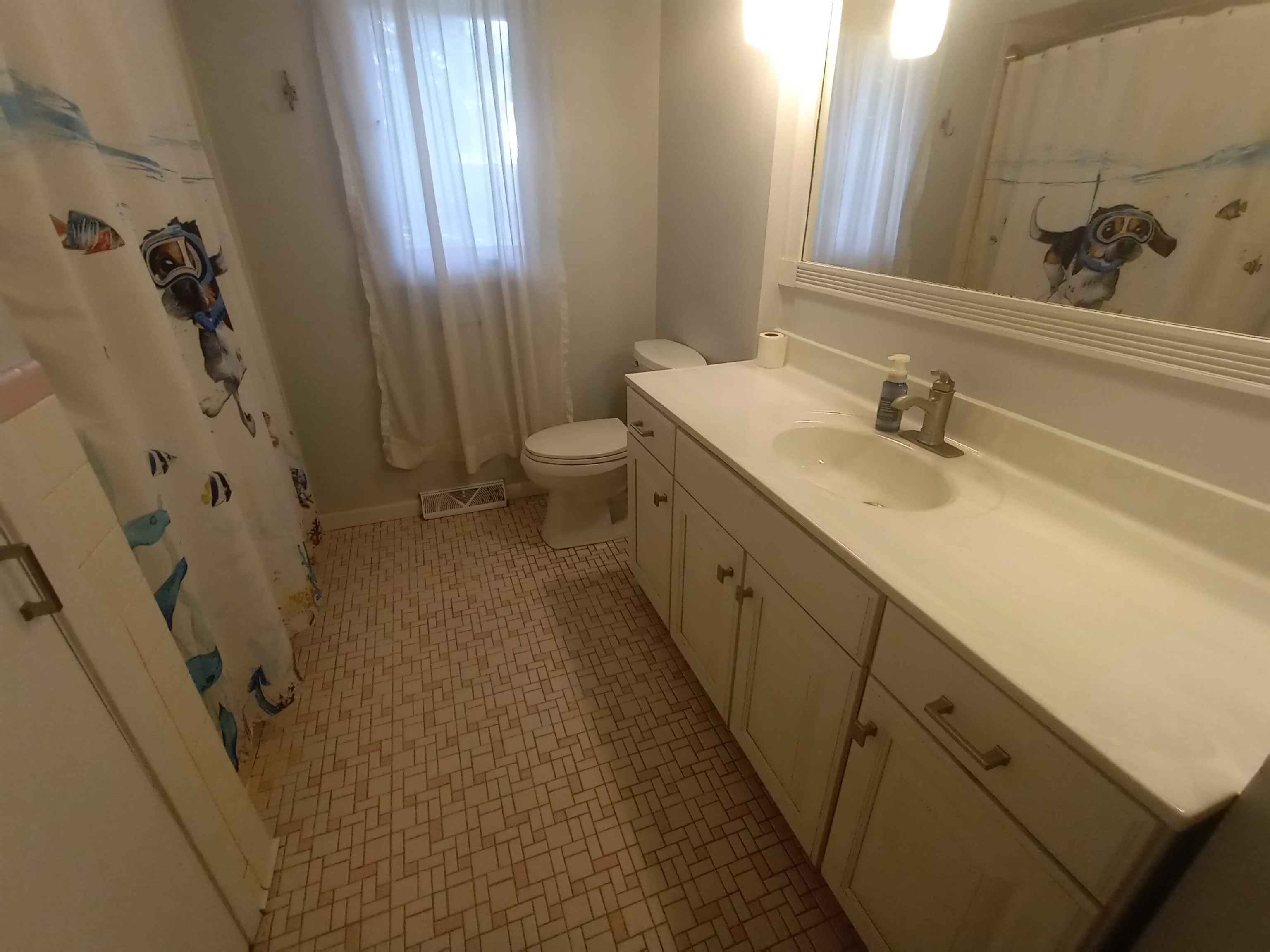 5242 Brookview Road Rockford, IL 61107 - Photo 16 of 44 a bathroom with a double vanity sink toilet and shower