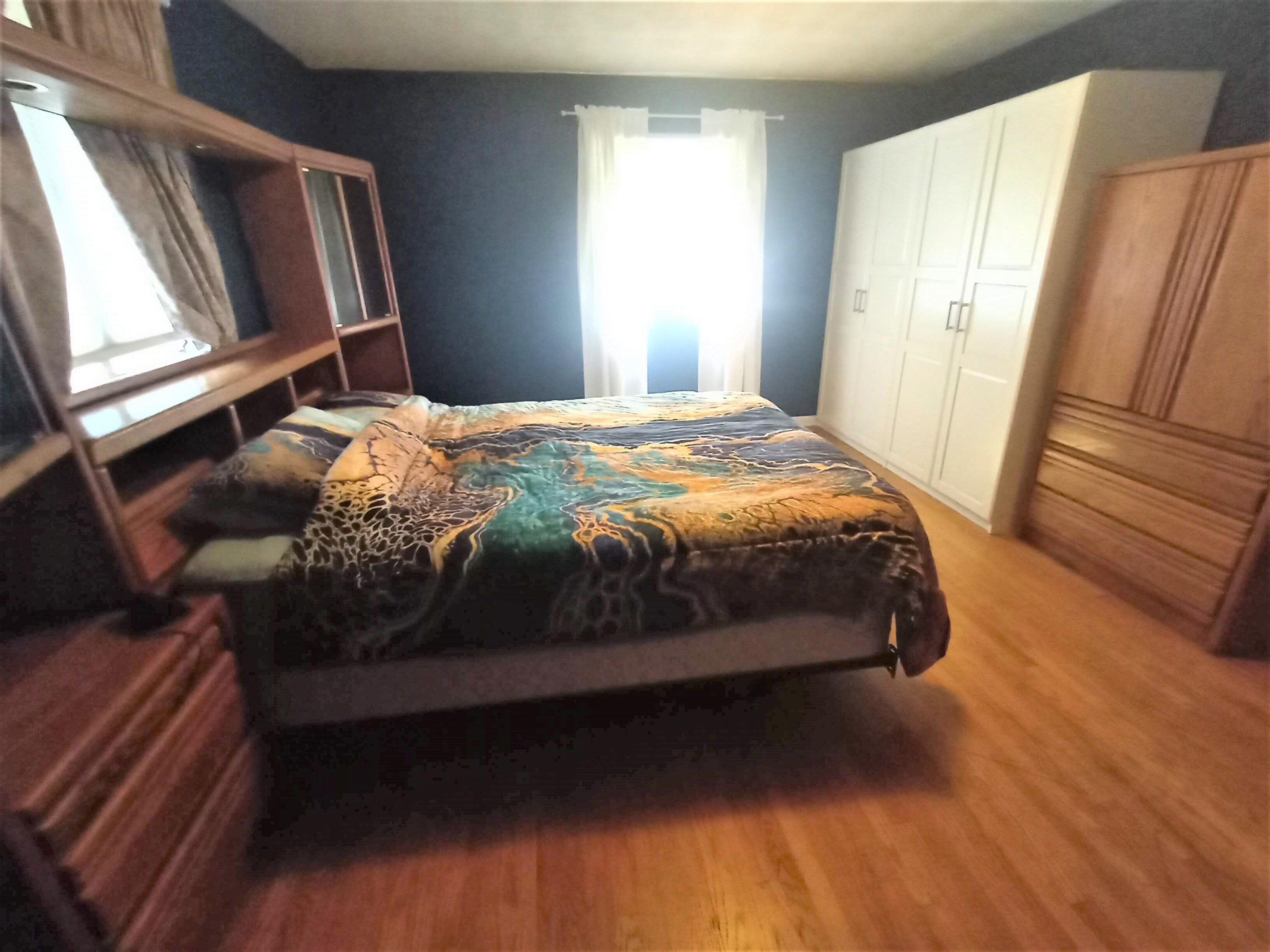 5242 Brookview Road Rockford, IL 61107 - Photo 20 of 44 a bed sitting in a bedroom next to a window