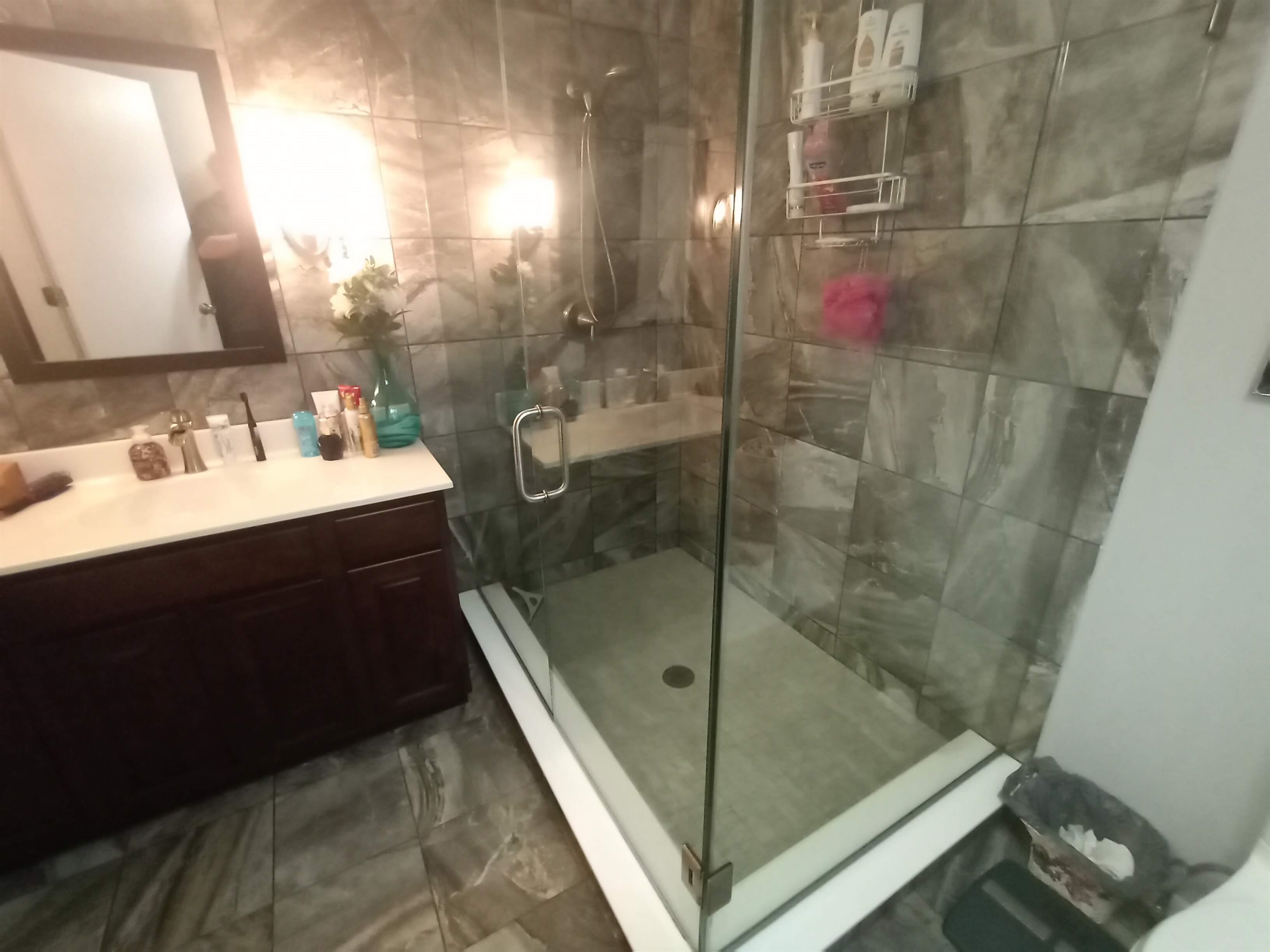5242 Brookview Road Rockford, IL 61107 - Photo 21 of 44 a bathroom with a sink mirror and shower