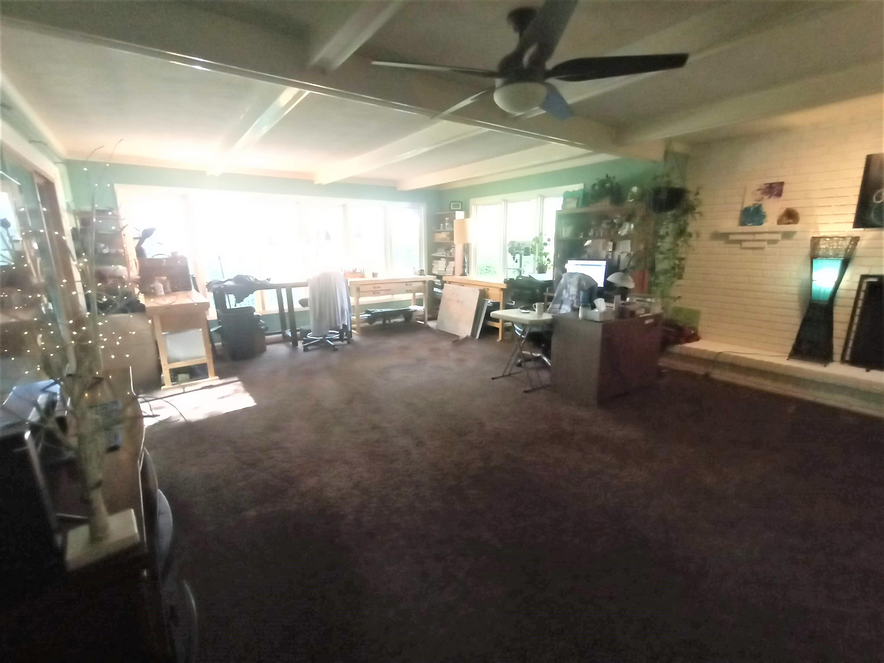 5242 Brookview Road Rockford, IL 61107 - Photo 24 of 44 a living room with lots of furniture and a chandelier