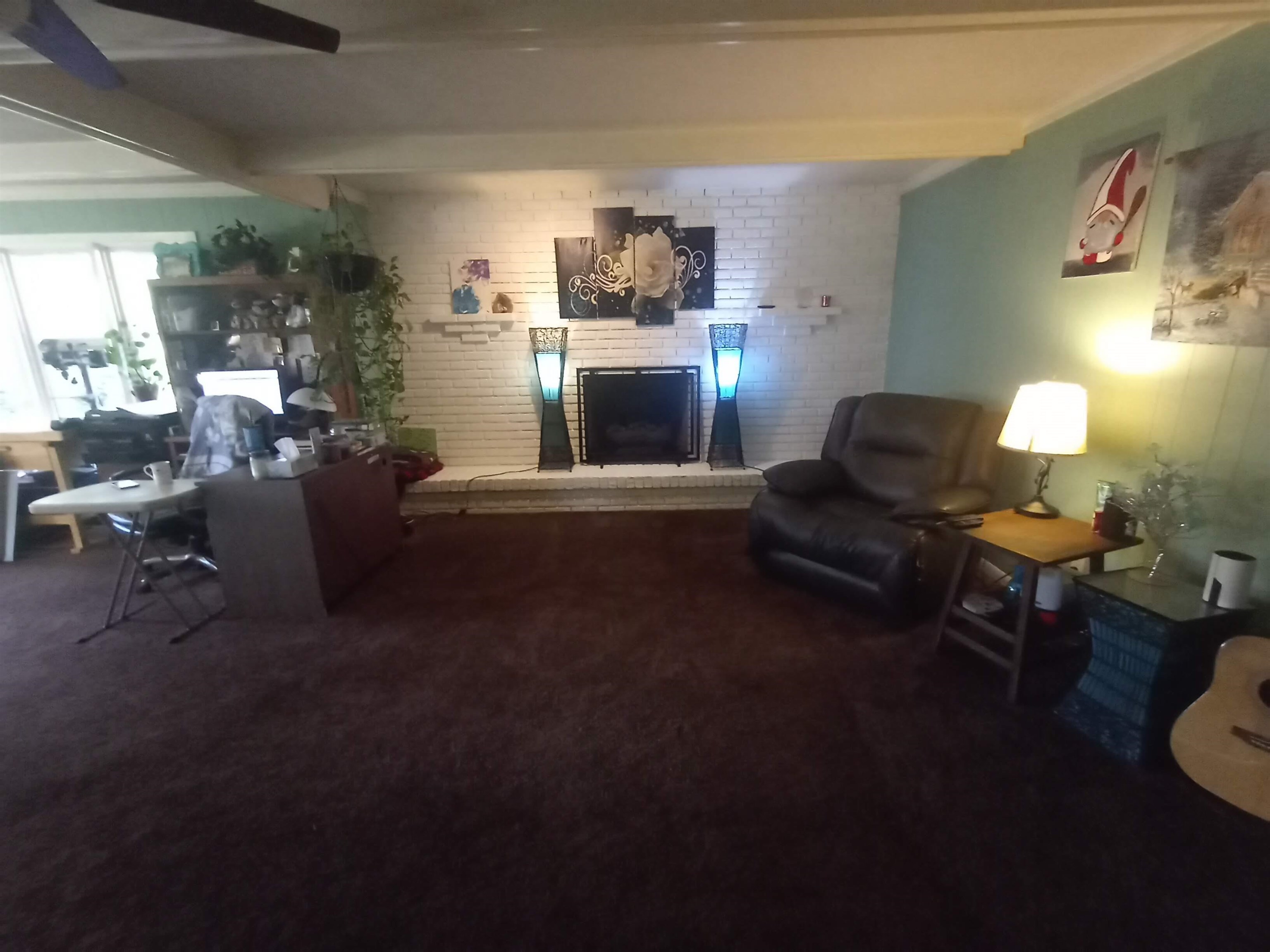 5242 Brookview Road Rockford, IL 61107 - Photo 25 of 44 a living room with furniture and a fireplace