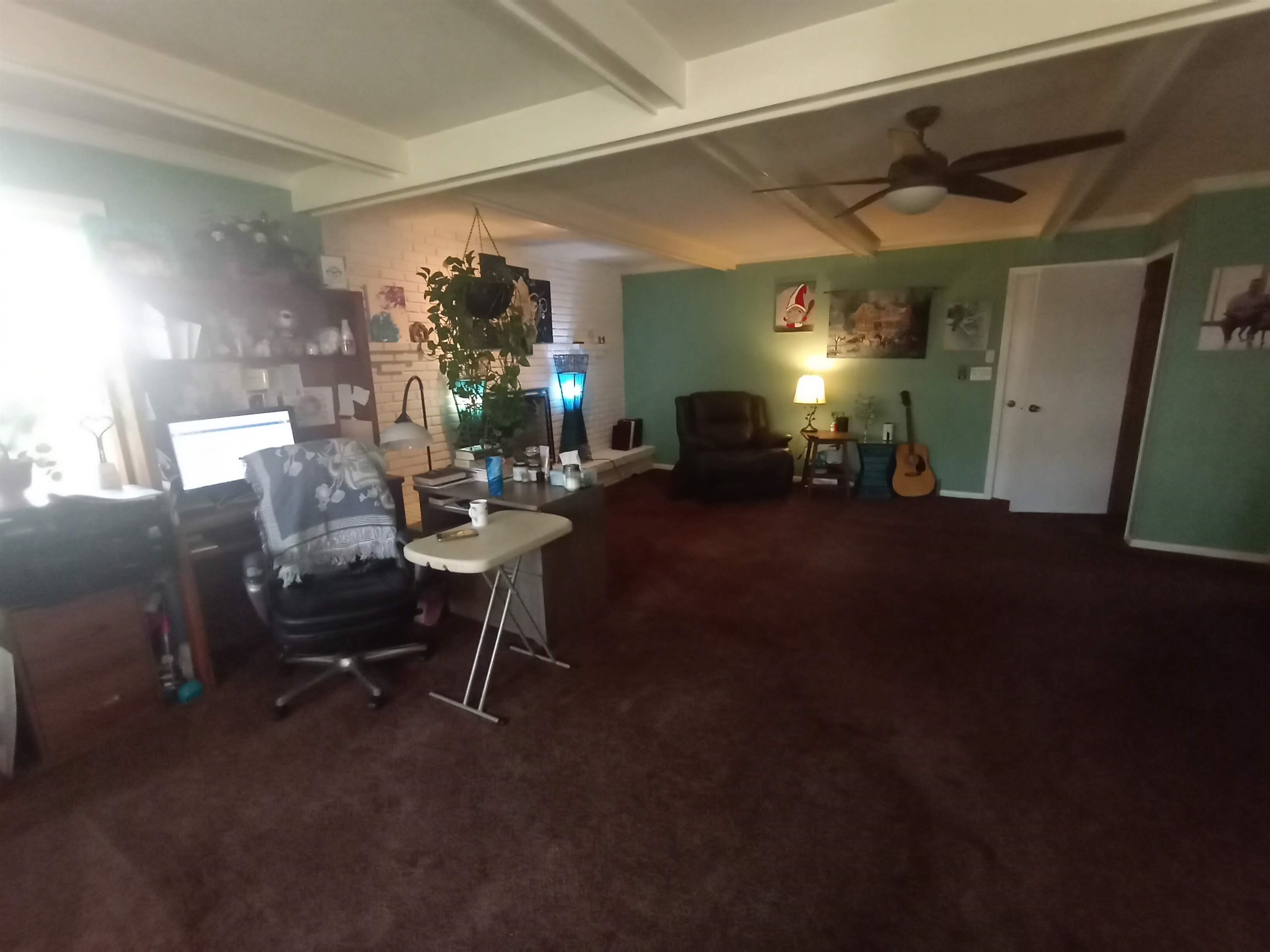 5242 Brookview Road Rockford, IL 61107 - Photo 27 of 44 a living room with furniture a dining table and a potted plant
