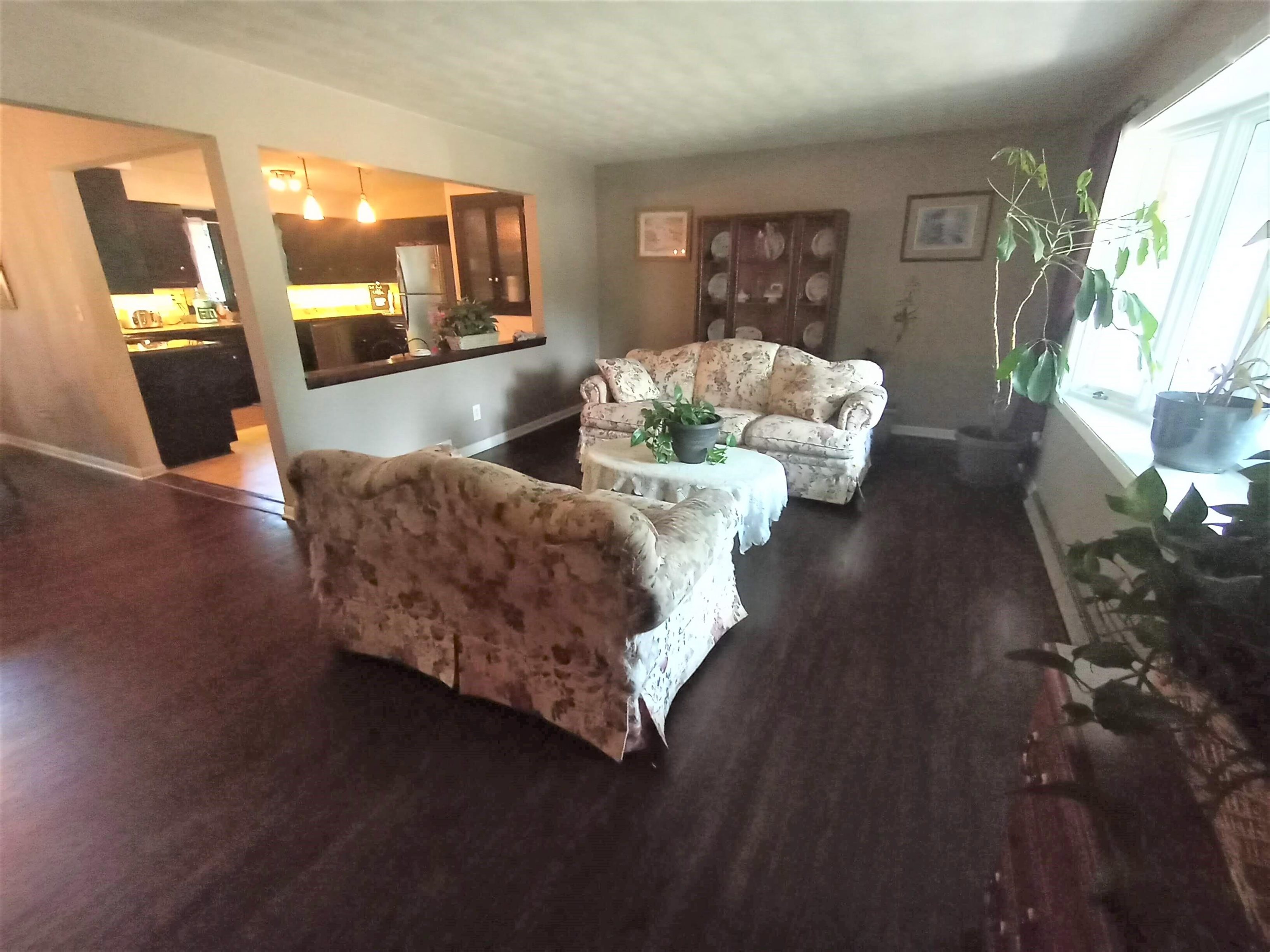 5242 Brookview Road Rockford, IL 61107 - Photo 3 of 44 a living room with furniture and wooden floor