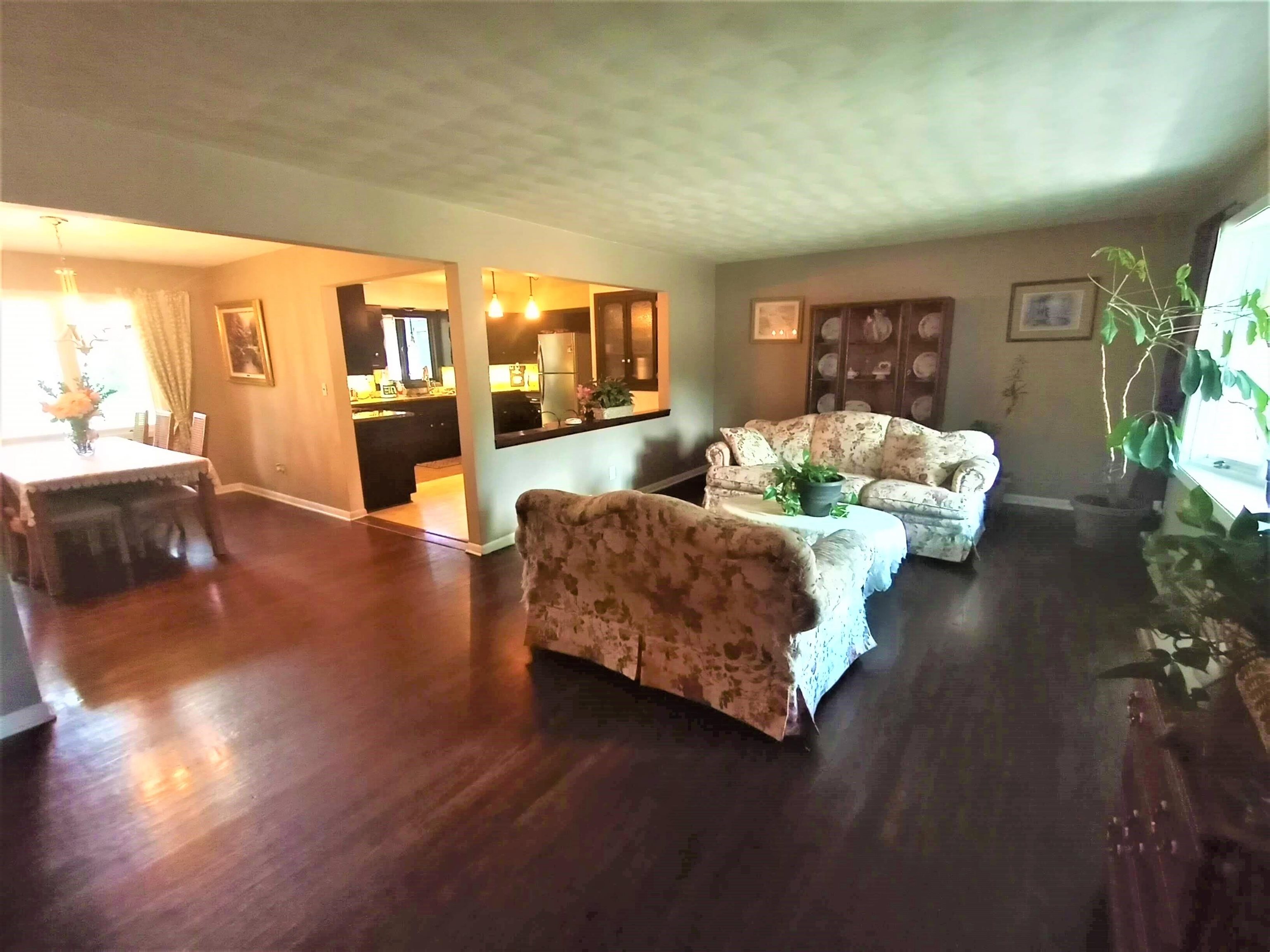 5242 Brookview Road Rockford, IL 61107 - Photo 7 of 44 a living room with furniture and a large window