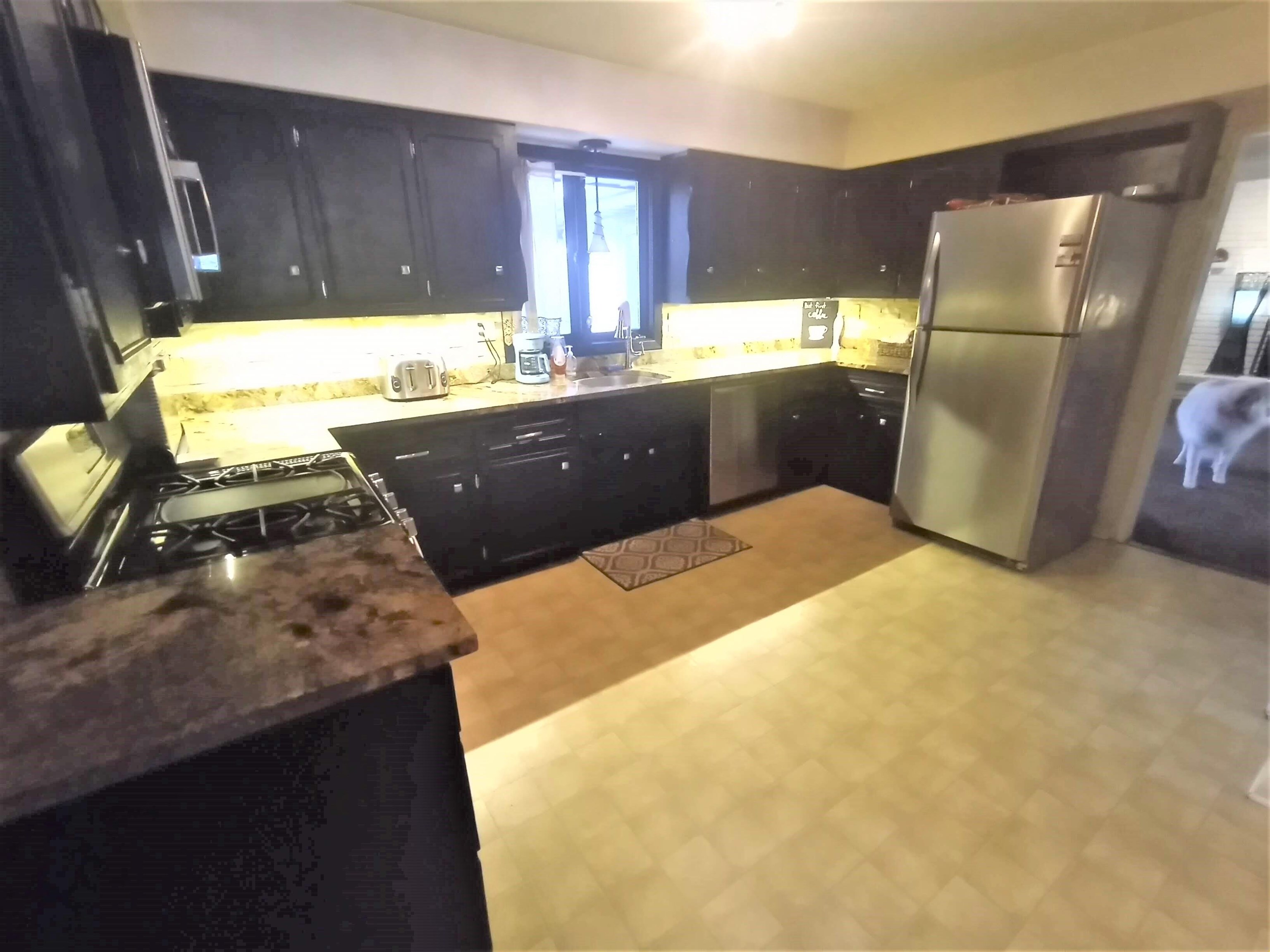 5242 Brookview Road Rockford, IL 61107 - Photo 10 of 44 a kitchen with a refrigerator and a stove