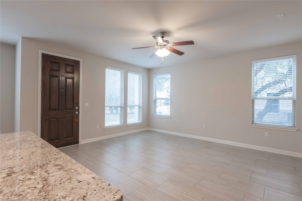 13800 Lyndhurst Street, Unit 281 Austin, TX 78717 - Photo 13 of 33 Living room with many windows with tree view.