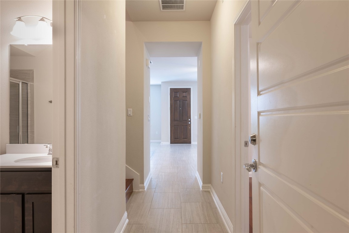 13800 Lyndhurst Street, Unit 281 Austin, TX 78717 - Photo 14 of 33 From back garage door to the front door point of view.