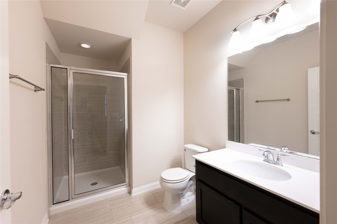 13800 Lyndhurst Street, Unit 281 Austin, TX 78717 - Photo 17 of 33 First floor bethroom featuring standing shower.
