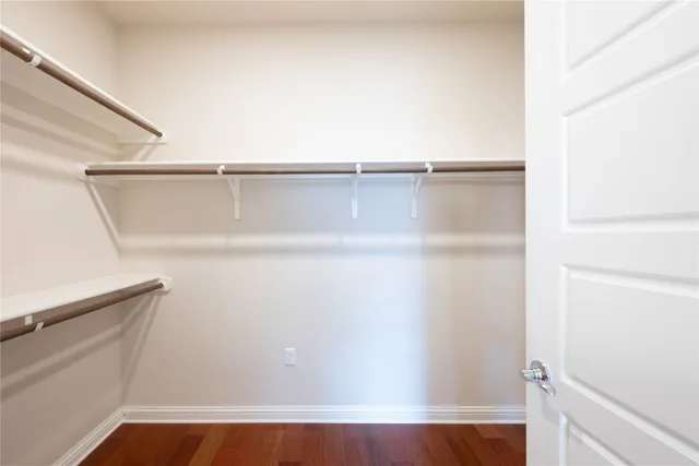 a utility room with granite countertop cabinets washer and dryer