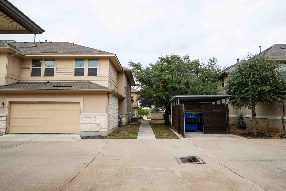 13800 Lyndhurst Street, Unit 281 Austin, TX 78717 - Photo 4 of 33 Two car garage with extra storage spaces. Pool and trash can is within arms reach.