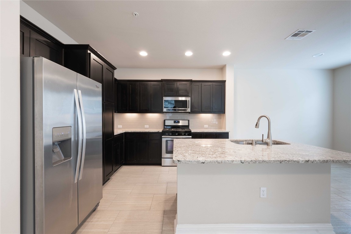 13800 Lyndhurst Street, Unit 281 Austin, TX 78717 - Photo 8 of 33 Kitchen with rooms to store items.