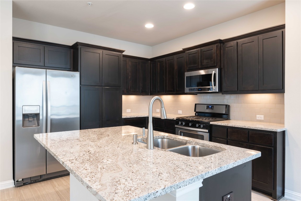13800 Lyndhurst Street, Unit 281 Austin, TX 78717 - Photo 9 of 33 Kitchen with rooms to store items.