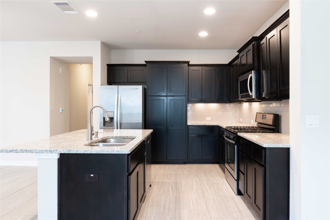 13800 Lyndhurst Street, Unit 281 Austin, TX 78717 - Photo 10 of 33 Kitchen with rooms to store items.