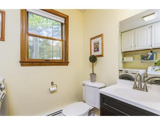 13 Oak Hill Street Pepperell, MA 01463 - Photo 16 of 30 a bathroom with a sink a toilet and a window
