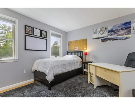 13 Oak Hill Street Pepperell, MA 01463 - Photo 20 of 30 a bed room with a bed and a night stand