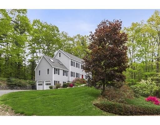 13 Oak Hill Street Pepperell, MA 01463 - Photo 2 of 30 a front view of a house with a garden