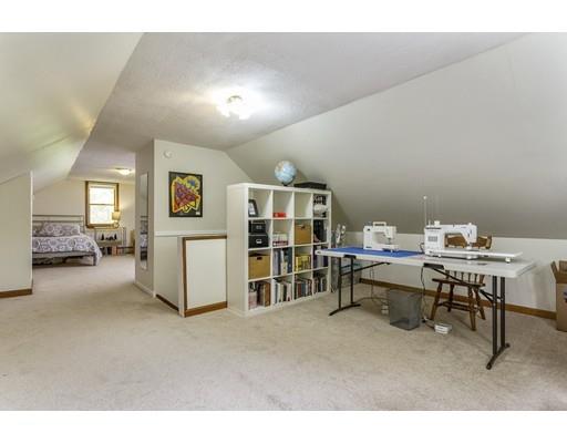 13 Oak Hill Street Pepperell, MA 01463 - Photo 24 of 30 a living room with furniture a table and bookshelf