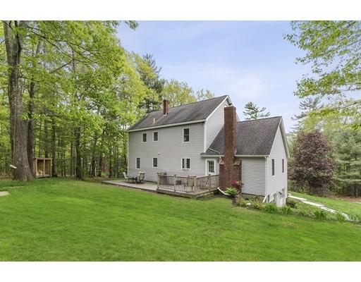 13 Oak Hill Street Pepperell, MA 01463 - Photo 26 of 30 a backyard of a house with table and chairs