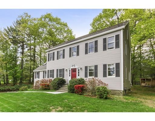 13 Oak Hill Street Pepperell, MA 01463 - Photo 3 of 30 a front view of a house with a yard