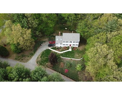 13 Oak Hill Street Pepperell, MA 01463 - Photo 5 of 30 a picture of a bench in a garden