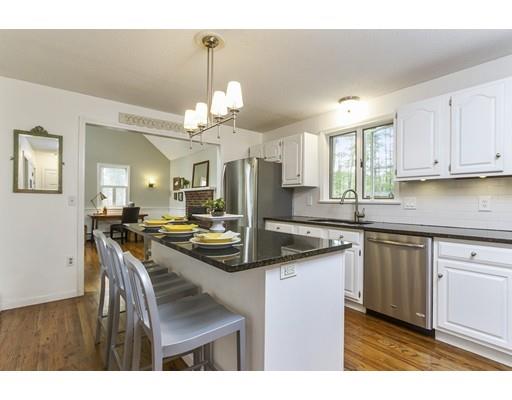 13 Oak Hill Street Pepperell, MA 01463 - Photo 10 of 30 a kitchen with kitchen island granite countertop a sink cabinets and wooden floor