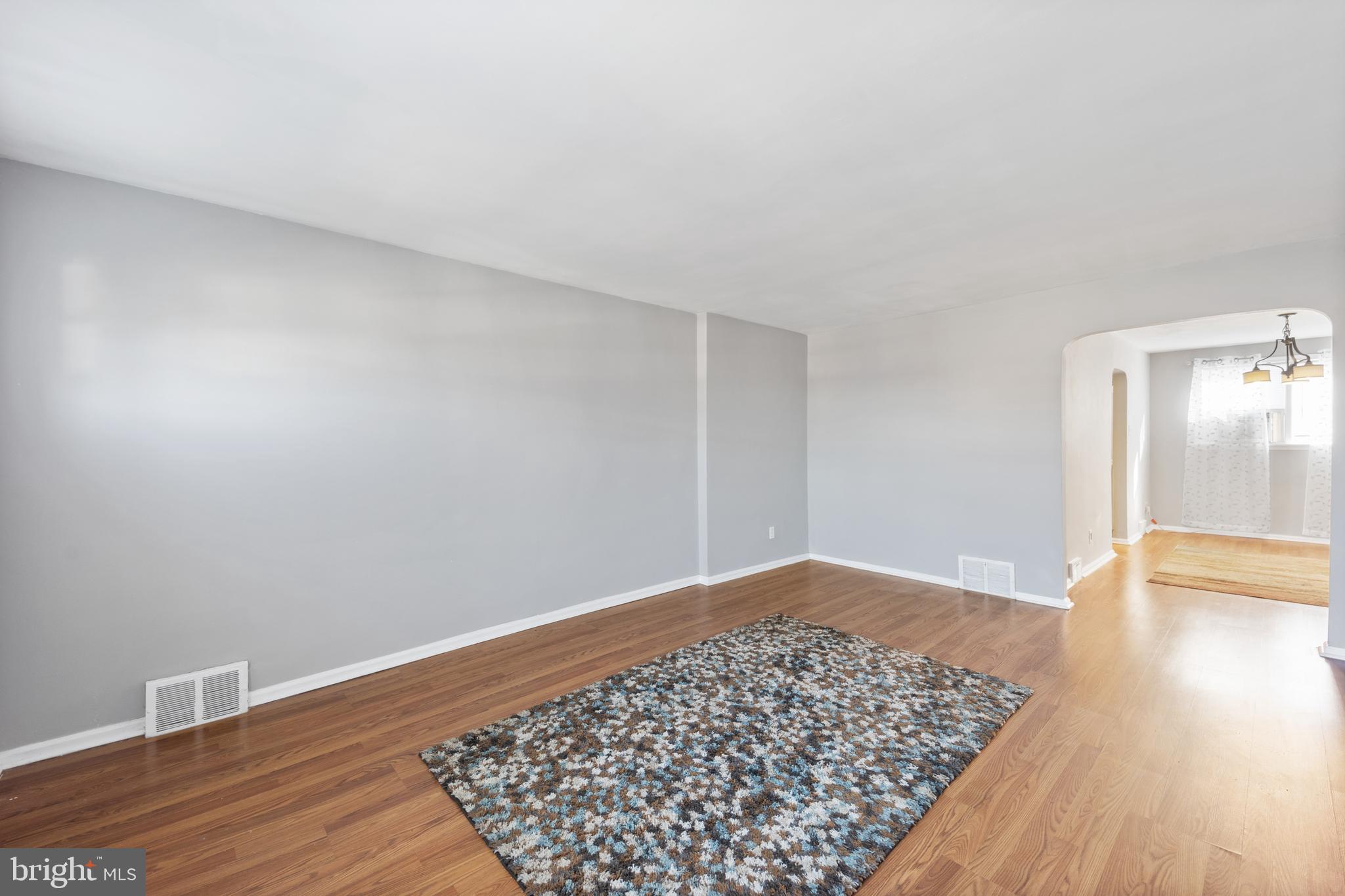 3006 Heather Road Folcroft, PA 19032 - Photo 4 of 25 a view of an empty room and wooden floor