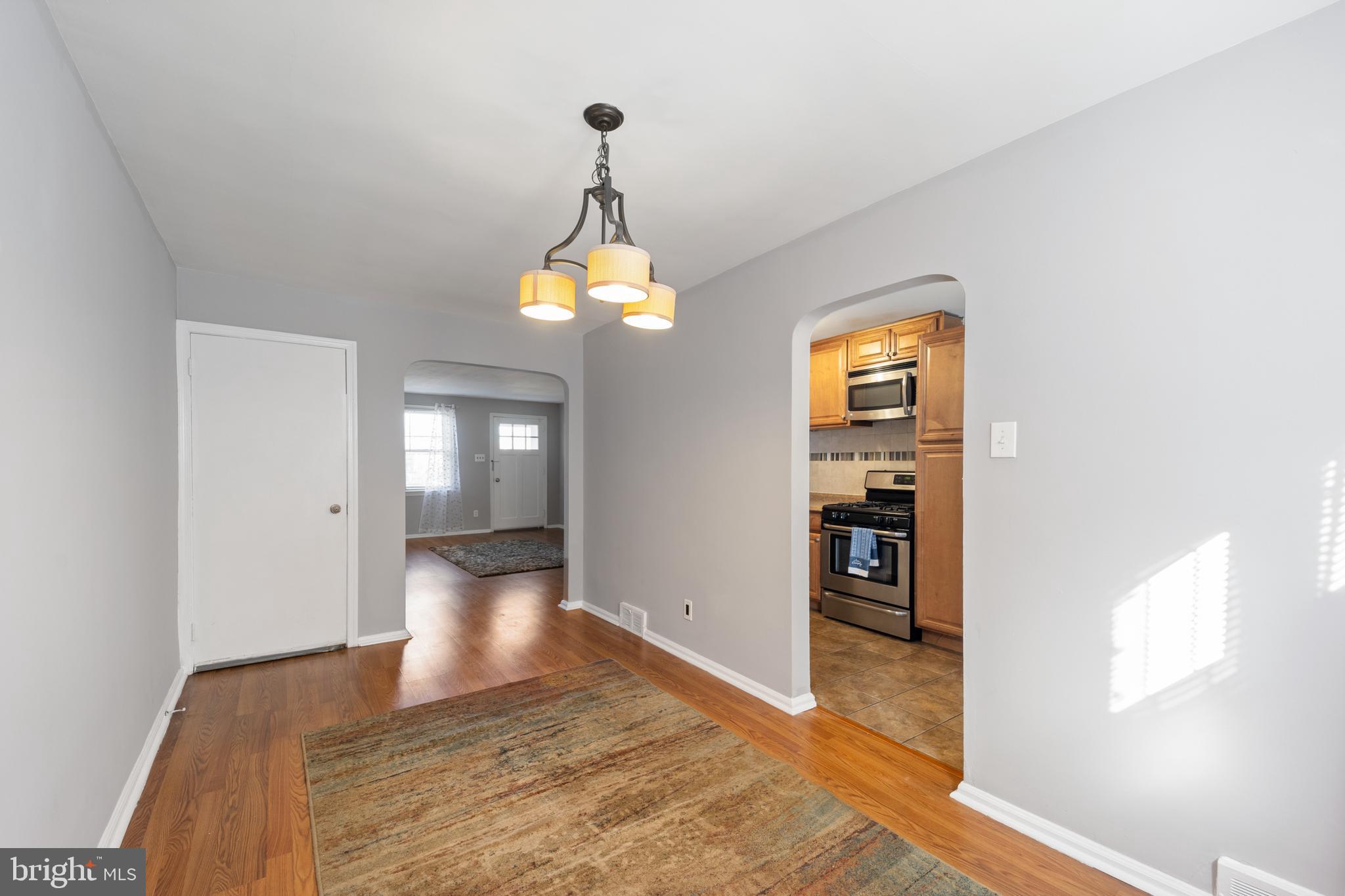 3006 Heather Road Folcroft, PA 19032 - Photo 8 of 25 a view of a hallway view with wooden floor and staircase