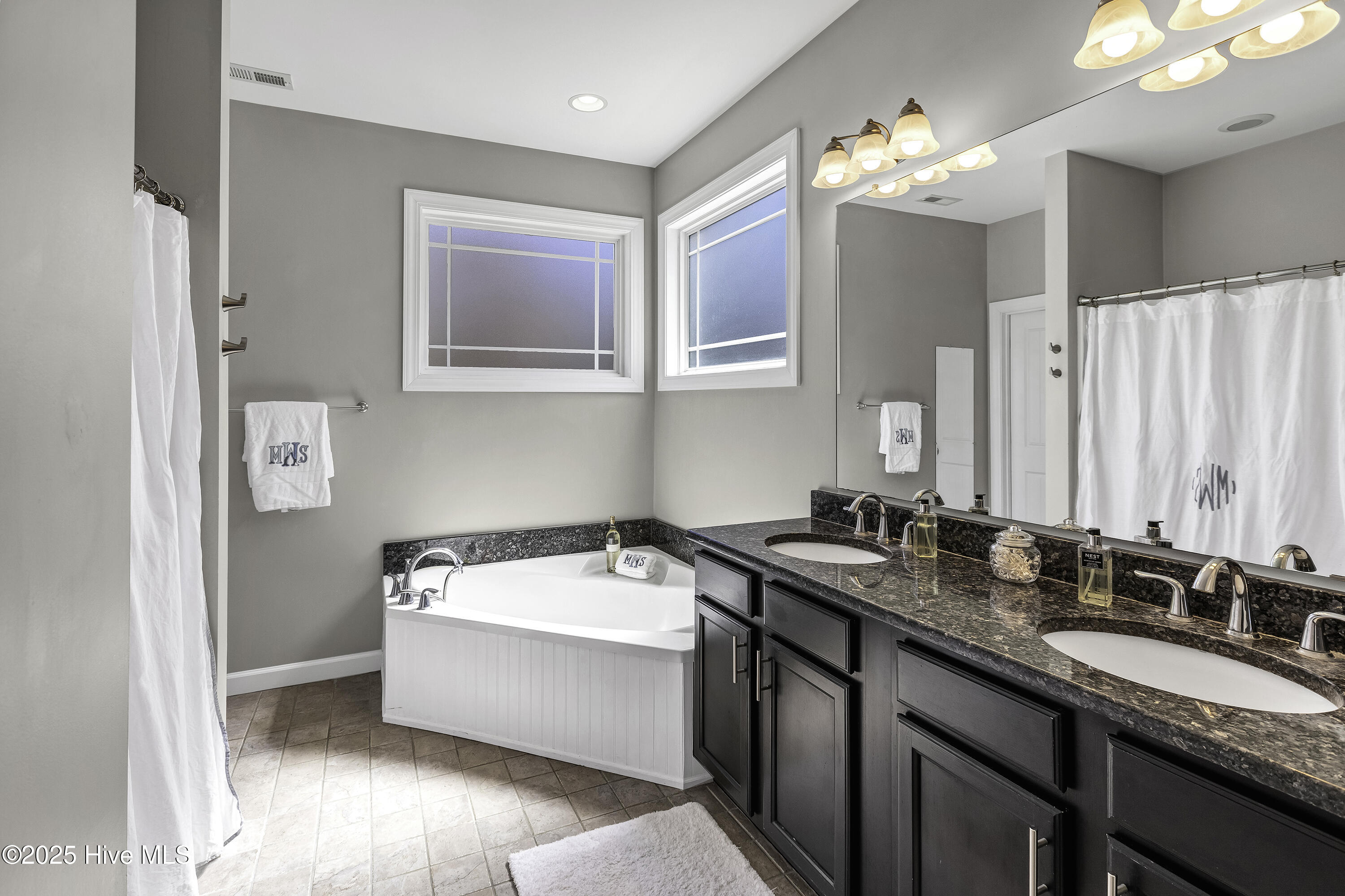 101 Holland Farm Road Cedar Point, NC 28584 - Photo 16 of 30 Soaking tub, double vanity, walk-in shower and a walk-in closet round out this fabulous primary bath.