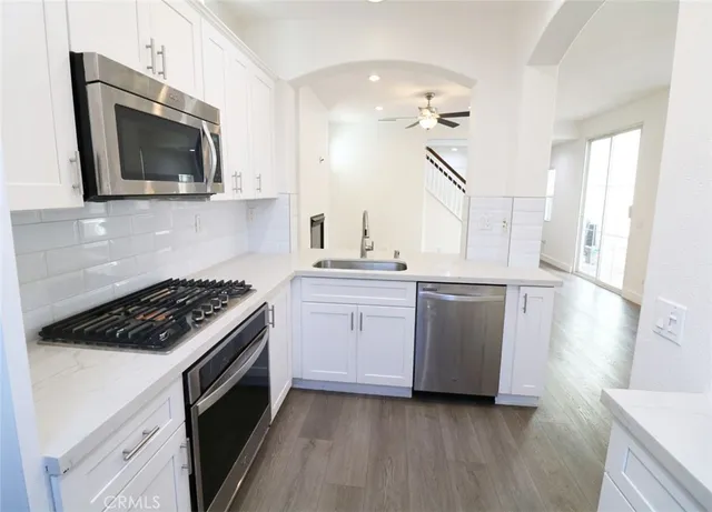 a kitchen with a stove and a microwave