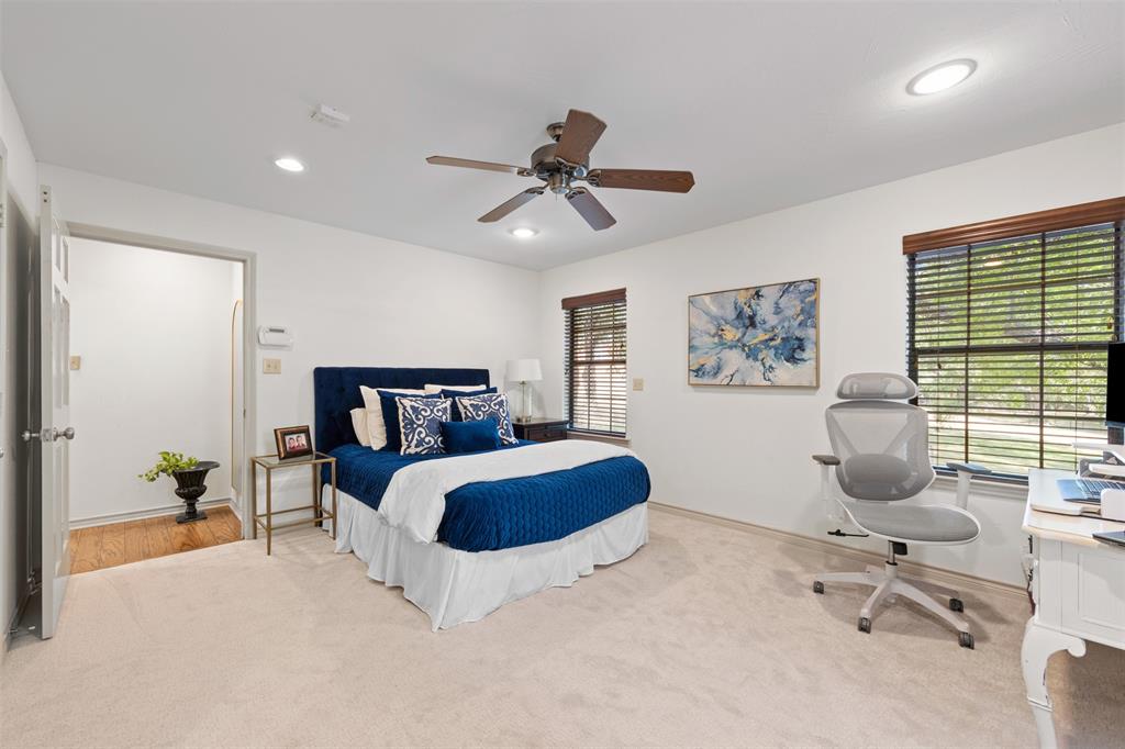 318 Ridge Creek Road Waxahachie, TX 75167 - Photo 17 of 40 Expansive room featuring plush carpeting, two windows with blinds, a ceiling fan, and recessed lighting