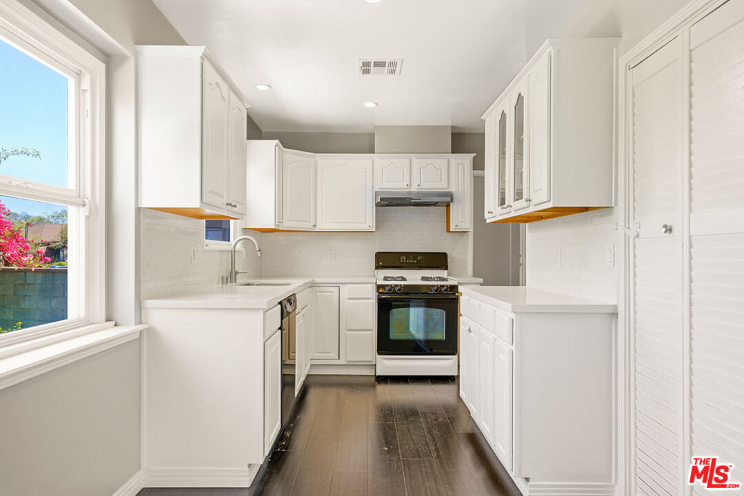 5343 Blanco Way Culver City, CA 90230 - Photo 12 of 30 a kitchen with stainless steel appliances a stove a sink and a refrigerator