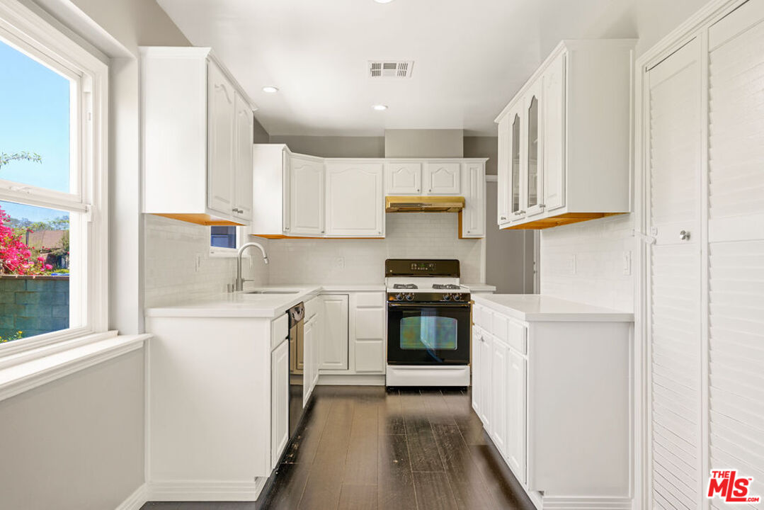 5343 Blanco Way Culver City, CA 90230 - Photo 13 of 30 a kitchen with stainless steel appliances a stove a sink and a refrigerator